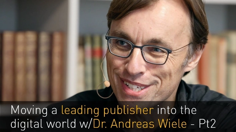 Man in library smiling at camera